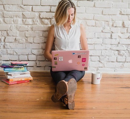 woman writing tips on writing a novel for the first time